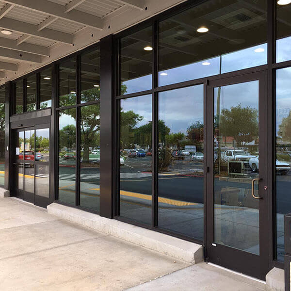 A large glass storefront with a large window.